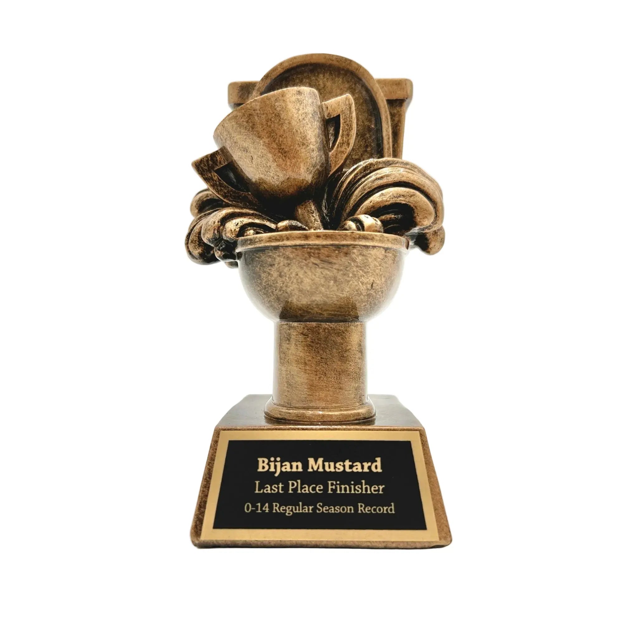 A bronze-colored trophy featuring a stylized toilet with a tilted cup on top, mounted on a rectangular base with a black plaque that reads 'Bijan Mustard Last Place Finisher - 0-14 Regular Season Record'.